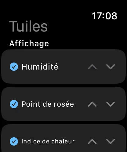 L’écran Vignettes sur la montre, intitulé Vignettes et Affichées, avec Humidité, Point de rosée et Indice de chaleur cochés, chacun avec des chevrons vers le haut et vers le bas.