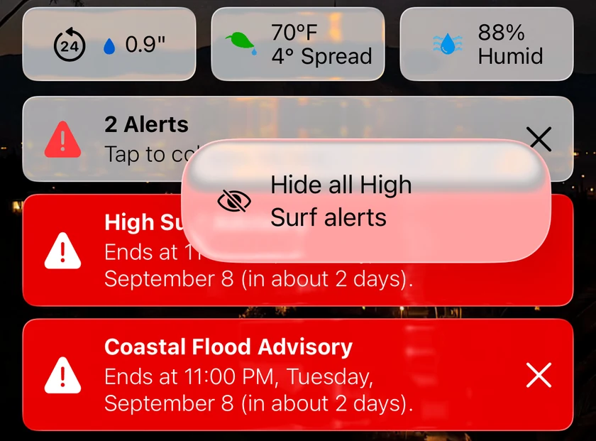 Two alert cards, High Surf Advisory and Coastal Flood Advisory, with the touch-and-hold menu open on the first card's close button offering Hide all High Surf alerts.