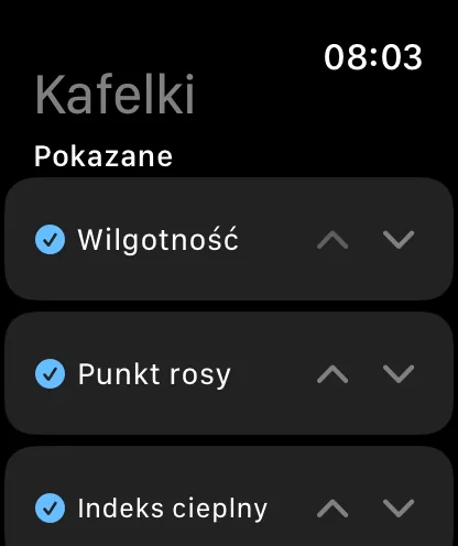 Ekran Kafelki na zegarku z nagłówkami Kafelki i Widoczne, z zaznaczonymi pozycjami Wilgotność, Punkt rosy i Indeks cieplny, każda ze strzałkami w górę i w dół.