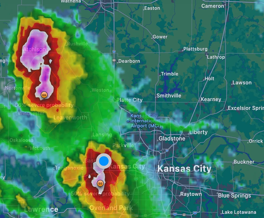Forecast Bar's full-screen radar on Apple TV zoomed on Kansas City during a severe thunderstorm evening, with two storm cells drawn over their hail cores near Atchison and Kansas City, each badged with its probability of turning severe: 66% and 60%